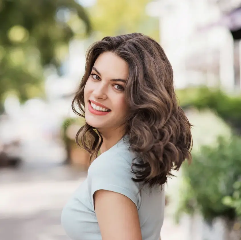A smiling woman outdoors