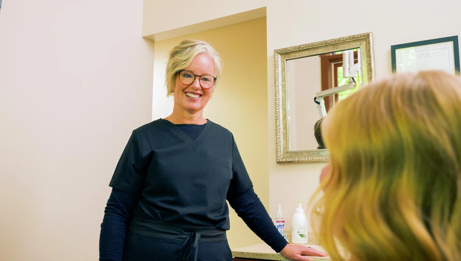 A team member warmly greeting a patient