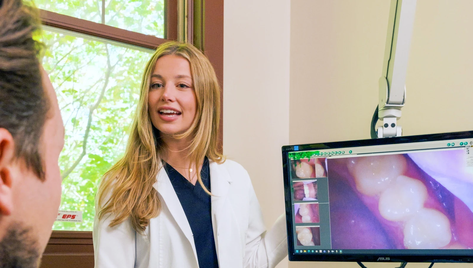 Dr. Austin reviewing intraoral camera images with a patient