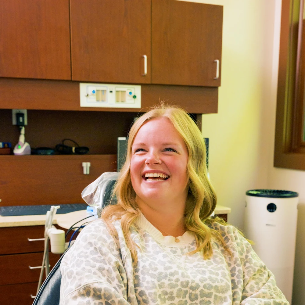 A smiling patient confident in her smile