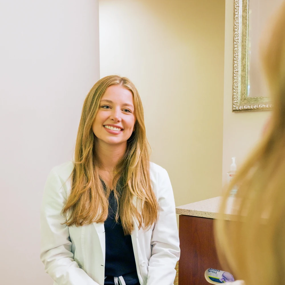 Dr. Austin smiling with a patient